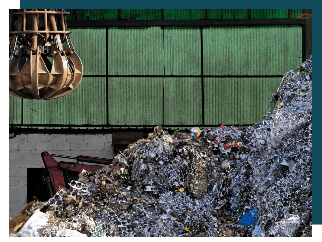 A pile of trash next to a building.